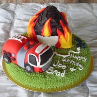 Firetruck And Blazing House Bottom is buttercake filled with Mock Bettercreme and covered in buttercream. The truck and house are white cake filled and frosted with...