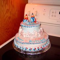 Clowncake The top is white cake filled with raspberry cream and the bottum layer is dark chocolate.