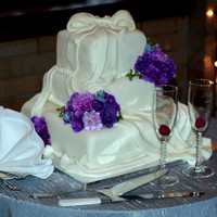 White Square Wedding Cake I made this as a gift for my son's friend.White Velvet on the bottom layer with raspberry. The middle layer is White Velvet with...