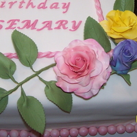80Th Birthday Cake Gum paste roses. Fondant accents and cover WASC w/ raspberry filling.