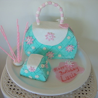Childs Handbag Cake This is a first go at a handbag Cake, I made it for my grandaughters 7th Birthday. It's far from perfect, but if you don't look...