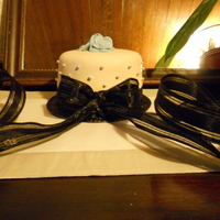 Wedding Cake Top Teir Chocolate cake with fondant, sugar pearls and fondant flowers topping cake and cupcakes