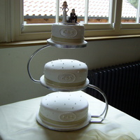 My First Wedding Cake Wedding cake with gumpaste / fondant monogram and royal iced pearls.