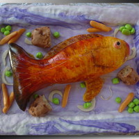 Christmas Red Fish The tray is rice treats covered in mmf. The fish is Almond Lemon pound cake with strawberry syrup over top, covered in mmf. The potatoes...