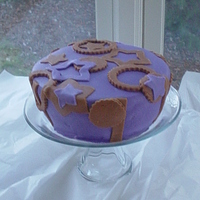 Purple/brown Fondant Cake Was playing around with fondant one day and came up with this one.