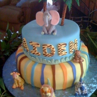 Zoo Crew Cake Here is a cake we made for a baby shower. The theme was the Zoo Crew. All the little animals are made from fondant.