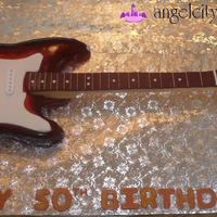 Guitar Cake - Fender Strat We originally made a Fender Electric Guitar Cake just so we could take pictures of it and post them on our website. Within three weeks we...