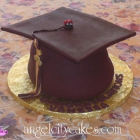 Graduation Cap Cake Here is a graduation cap cake we made using gumpaste for the mortarboard and fondant.