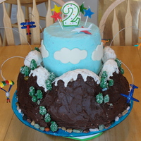Airplane Cake This was for my son's 2nd birthday. I used Rice Krispies for the mountains and then stacked a 3 layer 6 inch round cake in the middle...