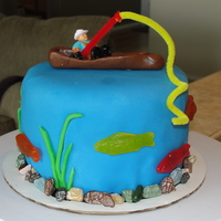 Fishing Cake This cake was made with fondant, pipe cleaners, Tootsie Rolls, Swedish fish, and chocolate rocks, and a toy man!