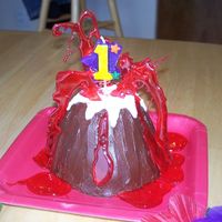 Volcano Cake I made this for my son's own little cake for his first birthday luau! I got the idea from the Family Fun Birthday Cakes book on p. 36...