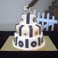 50Th Wedding Anniversary This cake was made for my grandparent's 50th wedding cake. This was my first tiered cake besides the one made in cake class. I was...