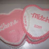 10Th Anniversary Two heart cakes that are connected together.