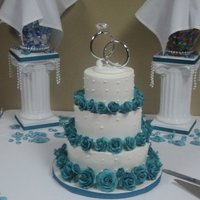 Wedding Cake Wedding cake iced with buttercream and gumpaste teal roses.