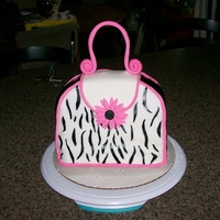Purse Cake I made this for my cousin's birthday. Its devils food cake with fudge filling and swiss buttercream. She loved it. Unfortunately my...