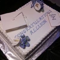 Hs Graduation Cake This was a yellow cake (four layers) torted with strawberry and vanilla fillings, frosted in BC. Grad cap, diploma and flowers are made...