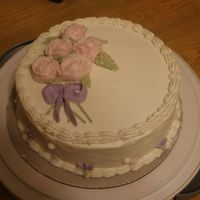 Dsc01763.jpg Wilton Course I, class 4. I still have a lot of work to do with the roses. It is a Chocolate chip cake (without the choco chips) with a...