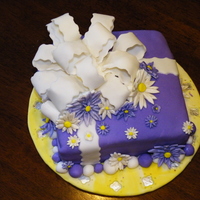 Purple Bow Cake I made this for my grandma, she had people coming to town. its a fondant cake with a bow and some daisy.
