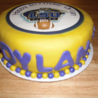 Lsu Birthday Cake Covered in yellow fondarific fondant. Picture is edible. Fondant accents. Had a blast doing this cake!