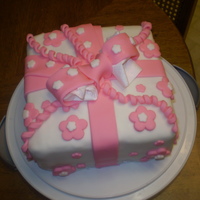 Package this is my course 3 fondant package cake. i really had fun making this cake. my bow wasn't finished drying out, that's why there...