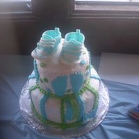 Converse Shoes Two-tired cake for a baby shower. i made the converse shoes out of fondant. it was my first time making the shoes. i'll get better at...