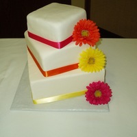 Squares And Daisies For Amy! This was a cake I made for a friend of mine from high school who got married. This was my first wedding cake, and while I know its not...