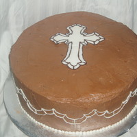 Funeral Cake Cake for my uncle's funeral. Mocha cake with chocolate BC filling. Chocolate transfer cross, with chocolate piped on the sides.