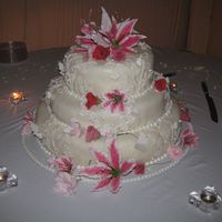Stargazer Wedding Cake This is my first wedding cake. The flowers and butterflies are gumpaste. I was generally pleased with the end result, but I had trouble...
