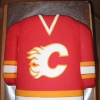 Calgary Flames Jersey Cake I made this retro Calgary Flames jersey cake for my cousin's birthday. All made with fondant.