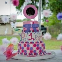 1St Birthday Cake Circle themed 1st Birthday cake. Cake topper was a photo (blacked out) of the child that was also in the centerpieces. All fondant with...