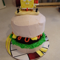 Crabby Patty Smash Cake I did this smash cake for a little girls Spongebob themed birthday. It is chocolate cake with buttercream icing. The topper was supplied by...
