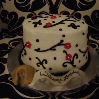 Asian Theme Baby Shower I did this mini cake for a friends adoption baby shower. I also did matching cupcakes. It is white chocolate buttercream with fondant...