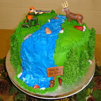 Hunting Themed Grooms Cake This was my first grooms cake. It is yellow cake with white chocolate buttercream icing. The accents are fondant and the "rocks"...