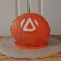 Bakugan This is made using the ball pan. I put a dowel rod through the center for support, and ran it all the way through to the cake board.