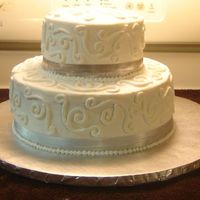 Silver Anniversary Cake Two tier annviersary cake covered with butter cream icing. Tip 5 used to draw design and ball boarder.