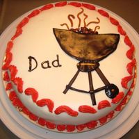 Dad's Day White fondant over cherry-chocolate cake, with ganache filling. Buttercream around edges color is reddish-orange like flame-red, didn'...
