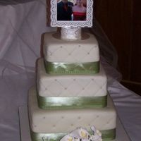 Aaron And Michelle's Cake This cake was a 3 tier - 6, 8, 10, chocolate with vanilla mousse filling and chocolate buttercream. It was covered in fondant with sugar...