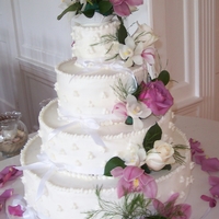 White Buttercream With Fresh Flowers My first tiered cake!! This cake had a bottom tier of Chocolate Stout Cake with choc. ganache filling, a second tier of Pumpkin Cake with...