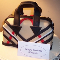 Purse Cake This is the Burberry inspired cake I made for my daughters birthday. It was a red velvet cake with cream cheese frosting for a filling,...