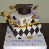Graduation Cake I made this cake for a law school graduate. First time using an airbrush (for the gold), wires, and my Cricut machine (for the lettering...