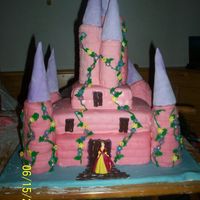 Pink Princess Castle My first attemt at a stacked cake and fondant. My turrents are made out of rice crispy treats but the ones in the back that are sagging are...