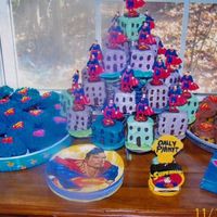 Booboo's Superman Birthday Cake Superman City with cupcake suburbs.