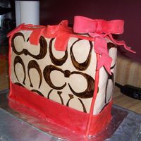 Coach Purse Cake The straps I made broke when I put them on the cake, so the ones on there are a last minute replacement. They didn't turn out great,...