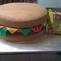 Hamburger Groom's Cake This was our first groom's cake order... chocolate chunk cake with buttercream icing, RKT "meat", and fondant detail....
