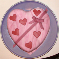 Pink Marble Fondant Valentine Cake Pink and White Marbled Fondant with pink hearts and bow.