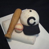 1909 Chicago Cubs This cake was done as a surprise to a great friend of ours, who is a HUGE Cubs fan. The hat and base are German Chocolate cake, and the bat...