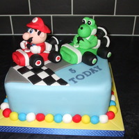 Mario Cake My orders where, " I would a mario cake, racing yoshi, but mario must win" I hope I suceeded!