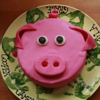 Oink Oink I made this as a practice cake. My friend wants a pig cake for her father inlaw's 59th birthday, and since I have only made 6 cakes...