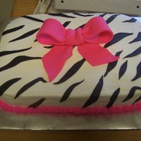 Hot Pink Zebra Cake Vanilla cake with vanilla bc. Bow and stripes are fondant.