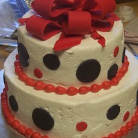 Red & Black Polka Dots Buttercream with fondant dots and bow.